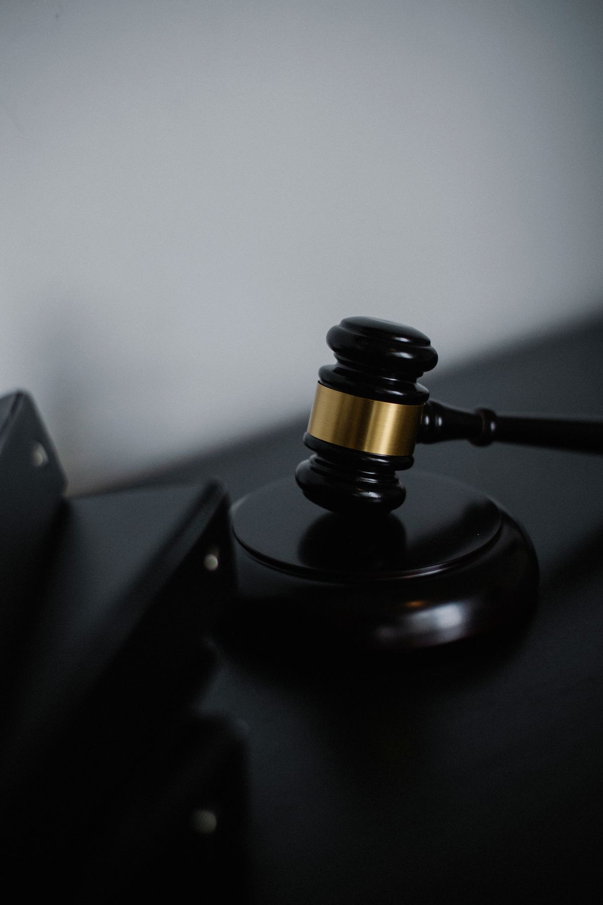 Close-up of a judge's wooden gavel on a desk, symbolizing law and justice